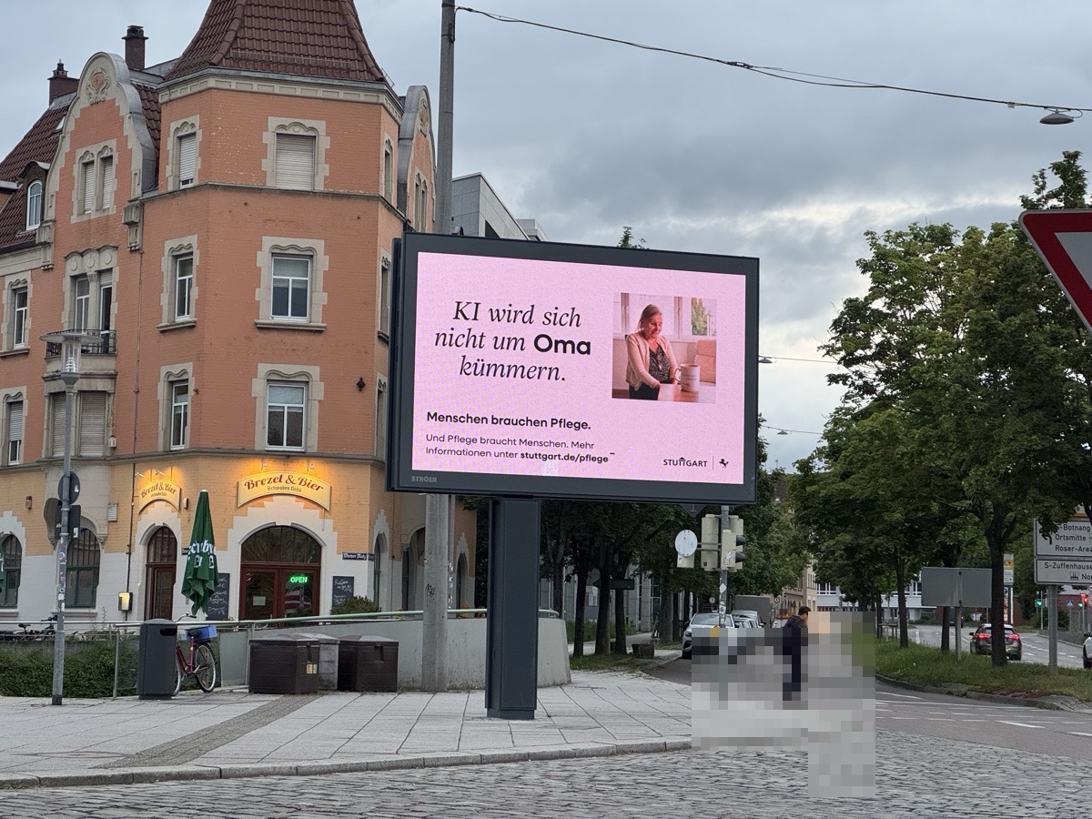 Live photo of a Stuttgart public care campaign at Feuerbacher Bahnhof; license plate and passer-by anonymized